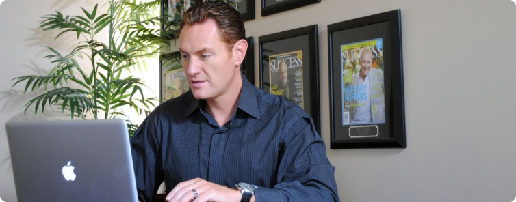 Darren Hardy on laptop